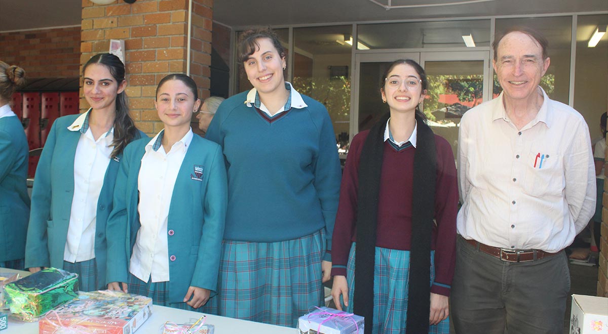 Students working the Mother's Day Stall