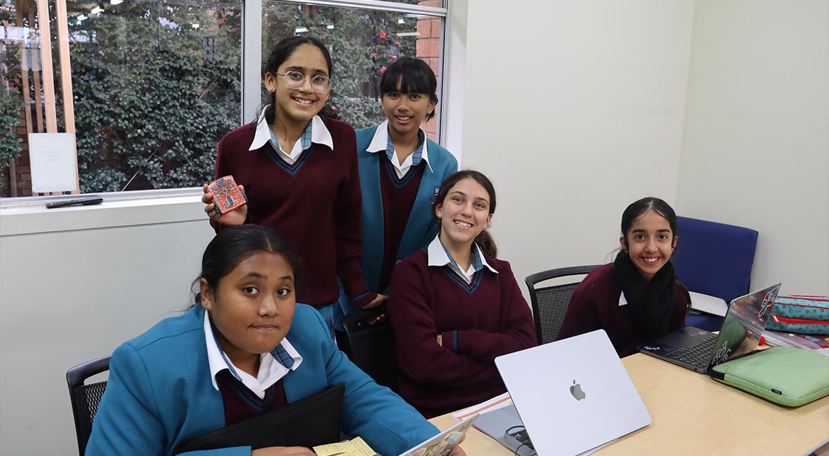 Year 7 students programming the Edison robots