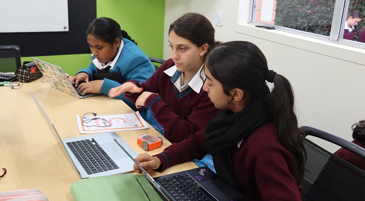 Year 7 students programming the Edison robots