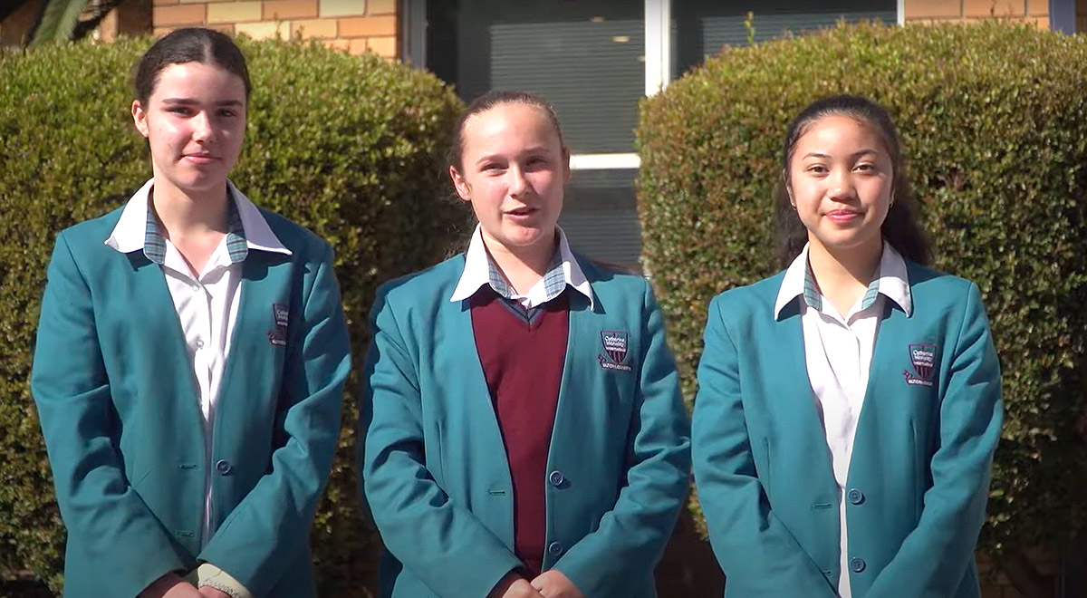 Three Catherine McAuley Catholic College Westmead students standing outdoors