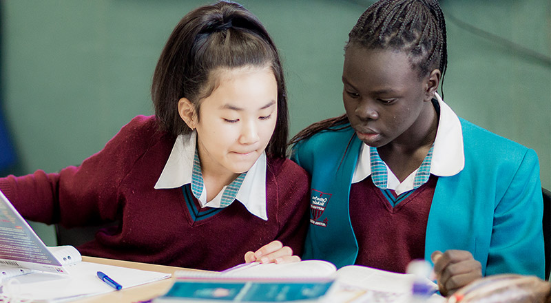 Happy Catherine McAuley Catholic College Westmead students in class