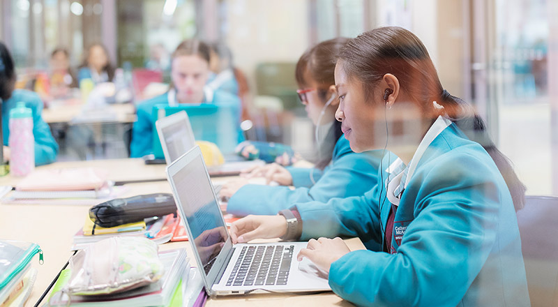 Catherine McAuley Catholic College Westmead students using learning devices