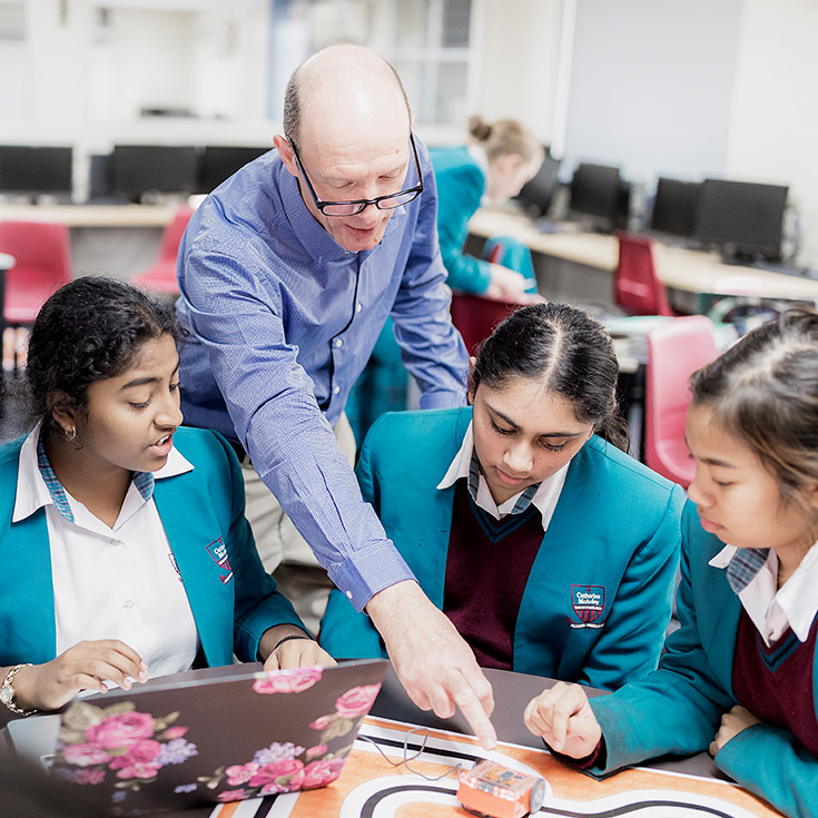 Teacher and students in class at Catherine McAuley Catholic College Westmead