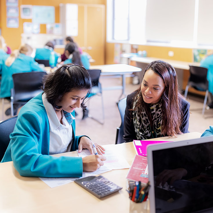 Teacher with student at Catherine McAuley Westmead